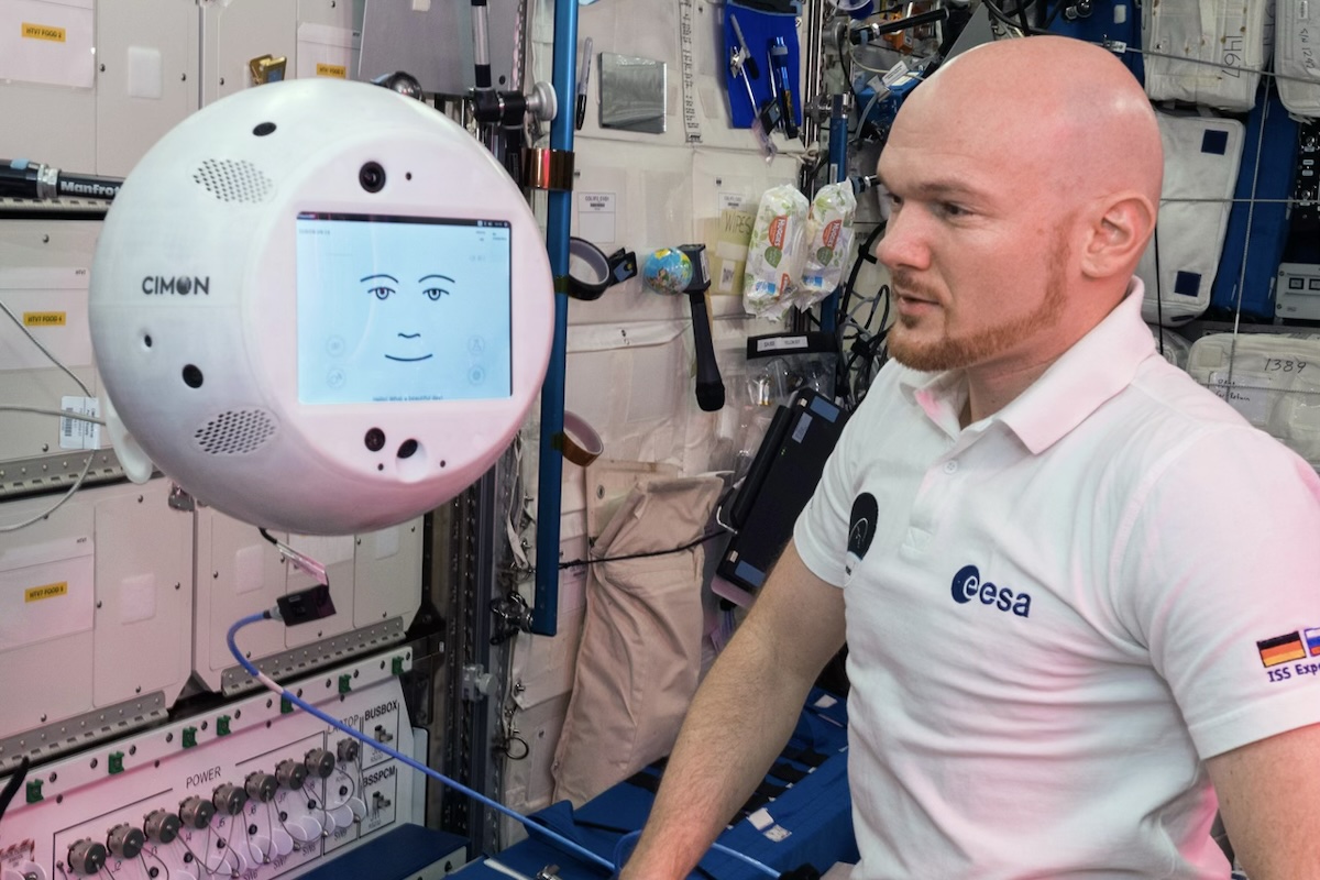ESA astronaut working with CIMON, the AI companion, aboard the International Space Station